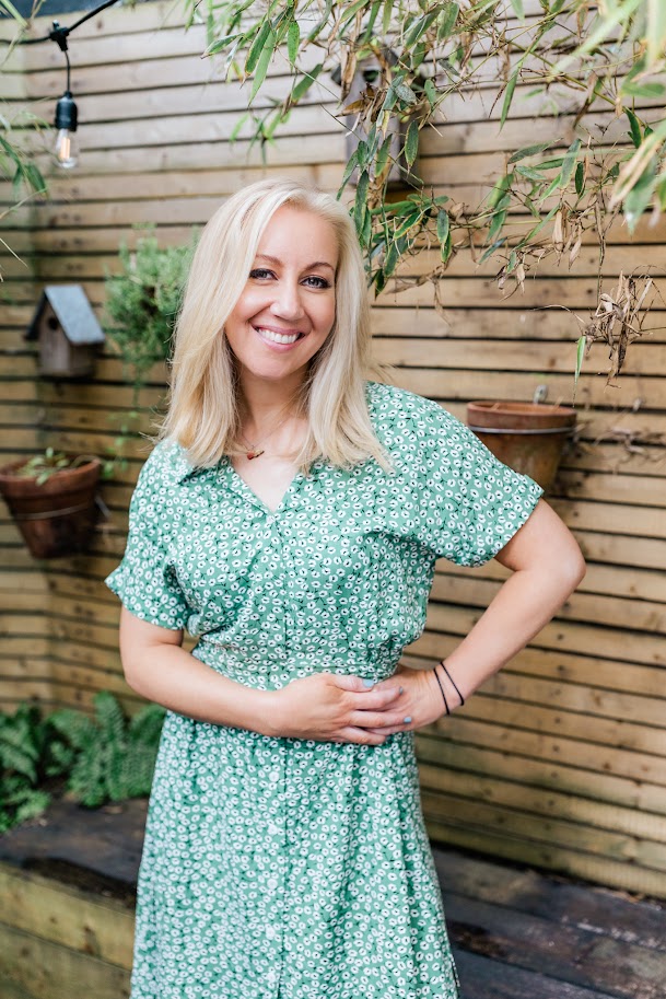 Helen wearing a green dress