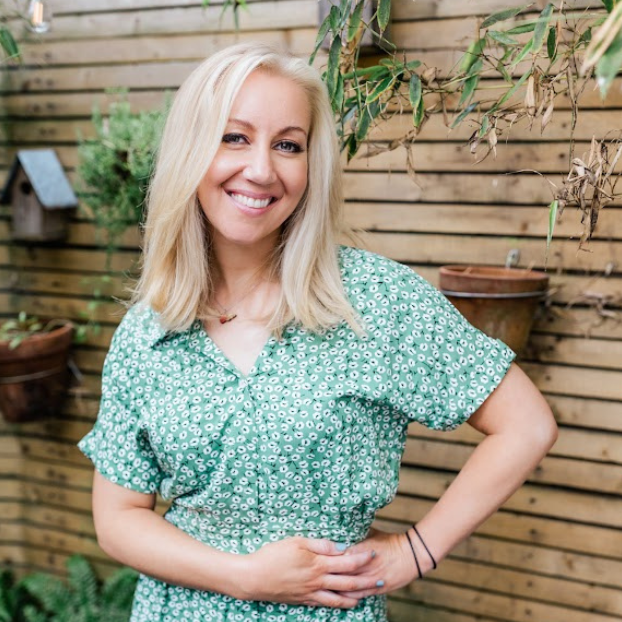 Helen wearing a green dress